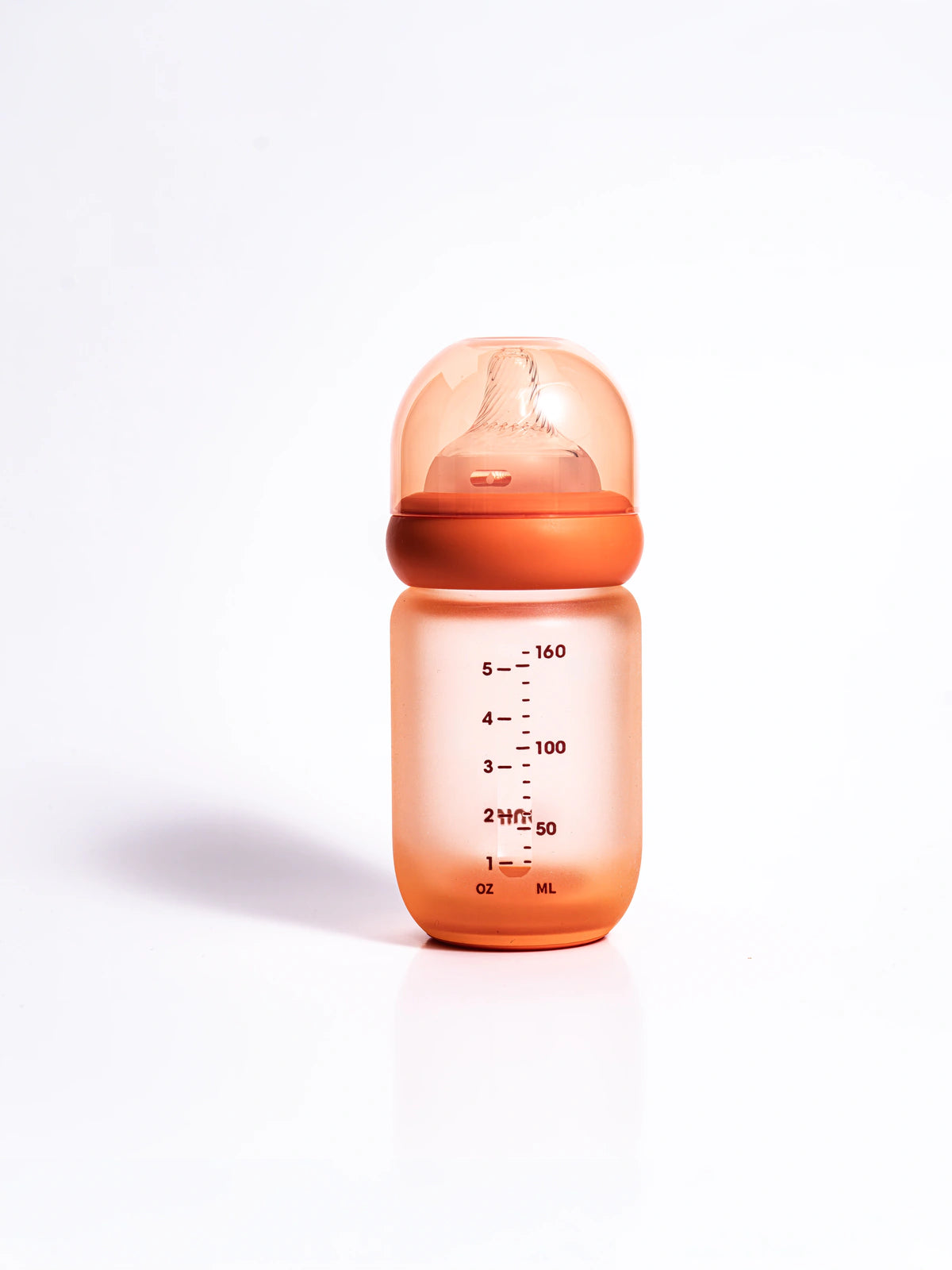 The Wrapped Glass Bottle with milk measurement markings in ml and oz
