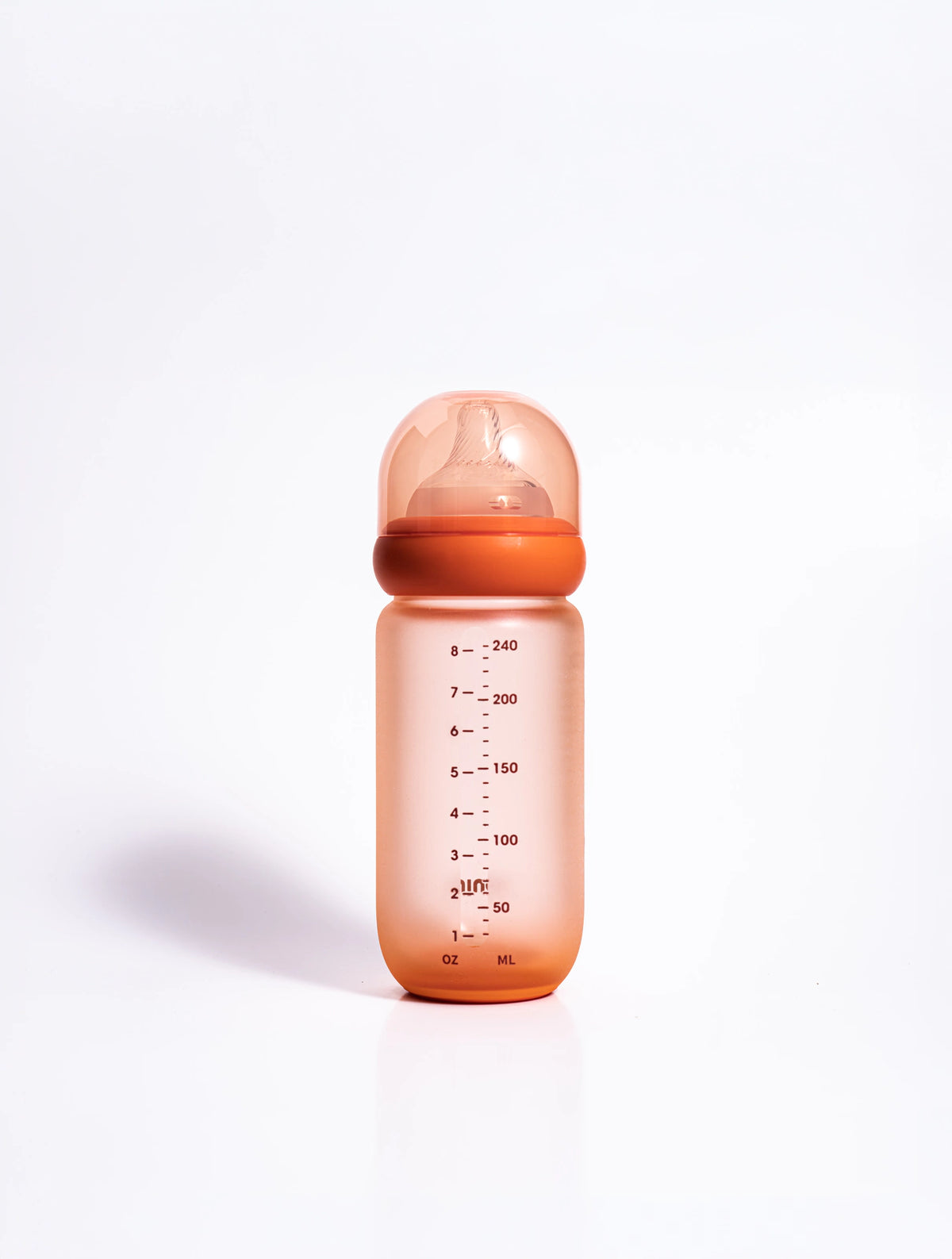 The Wrapped Glass Bottle from the side, showing its ml and oz markings